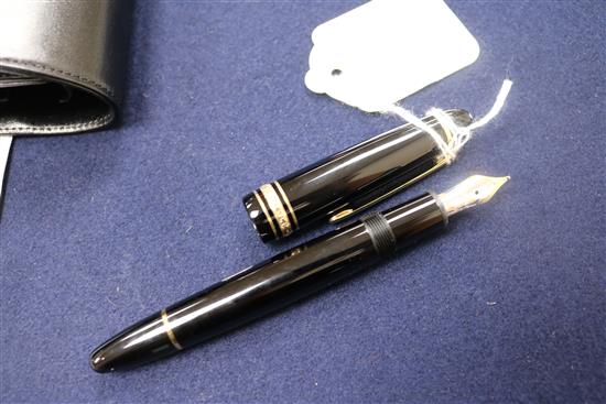 A Montblanc Meisterstuck black lacquered fountain pen, 14K gold nib, mint, in original leather pouch and box (1)